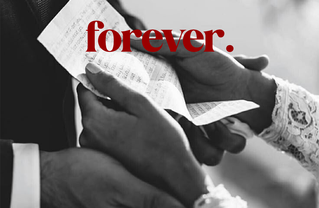 A shopping bag sitting on top of a green field.